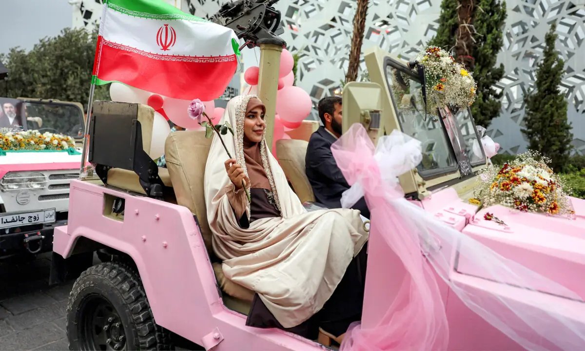 In pictures: Iran stages mass weddings for couples ready for war 'sacrifice'