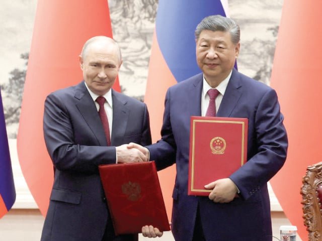 Xi warns of global slide back to 'law of the jungle'