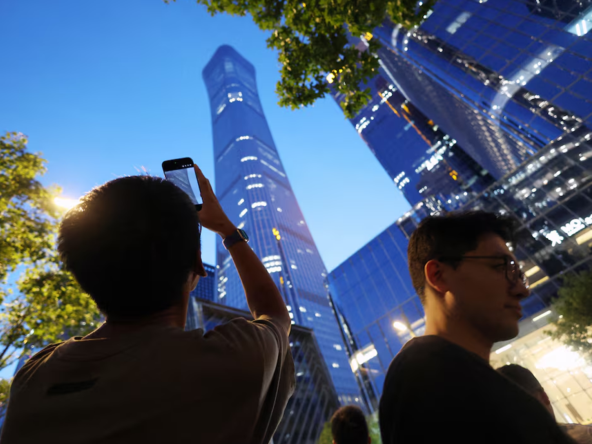 Small aircraft crashes into Beijing's tallest building, eyewitnesses say